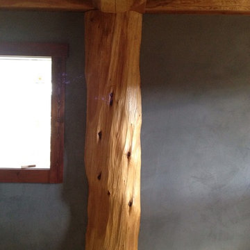 Log cabin Master Bedroom in Bragg Creek done In American Clay Natural Plaster