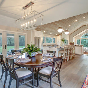 Mid-sized transitional medium tone wood floor and brown floor kitchen/dining room combo photo in Jacksonville with gray walls and no fireplace