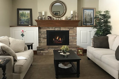 Living room - mid-sized traditional carpeted and beige floor living room idea in Salt Lake City with beige walls, a standard fireplace, a stone fireplace and no tv