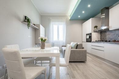 Small scandinavian living room in Milan with grey walls, porcelain floors and beige floor.