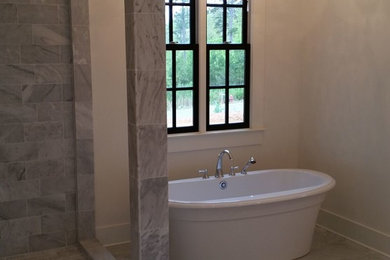 Large minimalist master marble floor bathroom photo in Little Rock with white walls and marble countertops
