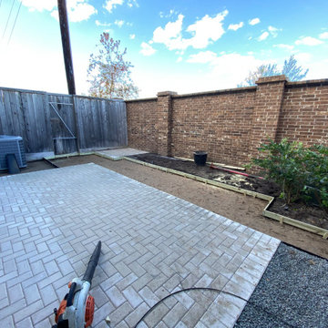 Pavers complete, flower bed and artificial turf boundaries being set.