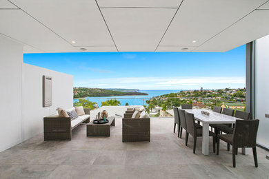 Example of a huge trendy home design design in Sydney