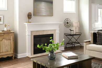 Living room - mid-sized transitional formal and enclosed medium tone wood floor, brown floor and vaulted ceiling living room idea in Atlanta with beige walls, a standard fireplace and a stone fireplace