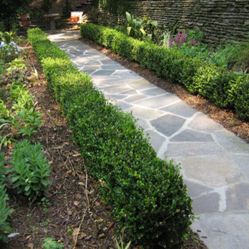 informal Bluestone walkway and stacked stone retaining wall