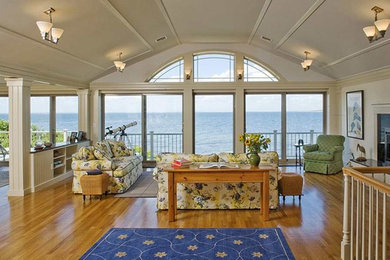 Living room - huge craftsman open concept light wood floor living room idea in Boston with beige walls
