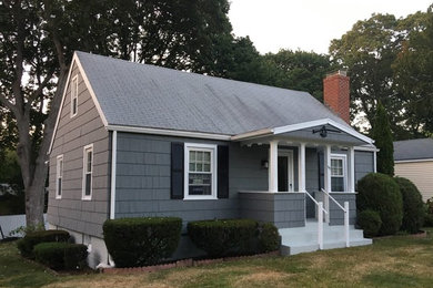 Mid-sized elegant gray two-story house exterior photo in Bridgeport