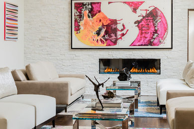 Inspiration for a large contemporary formal and open concept dark wood floor and brown floor living room remodel in Boston with white walls, a two-sided fireplace, a stone fireplace and no tv