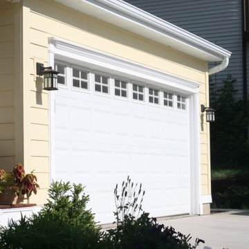 Cape Cod Style: Yellow Siding, White Trim, Black Shutters, Red Door, Roof Cupola