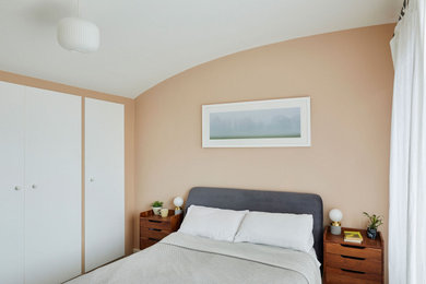 Example of a trendy bedroom design in London