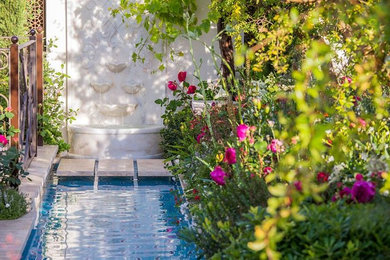 This is an example of a medium sized mediterranean garden in London.