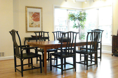 Dining room - mid-sized traditional light wood floor dining room idea in DC Metro with yellow walls and no fireplace