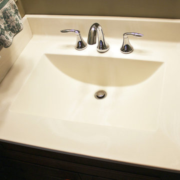 Updated Powder Room with Cherry Vanity and Cultured Marble Counter top