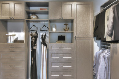 Example of a large transitional closet design in New York