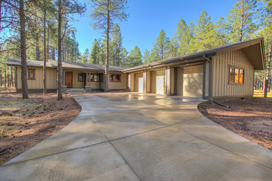 Mid-sized craftsman beige one-story exterior home idea in Phoenix with a hip roof
