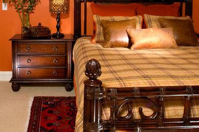 Inspiration for a mid-sized mediterranean guest carpeted bedroom remodel in New York with orange walls and no fireplace