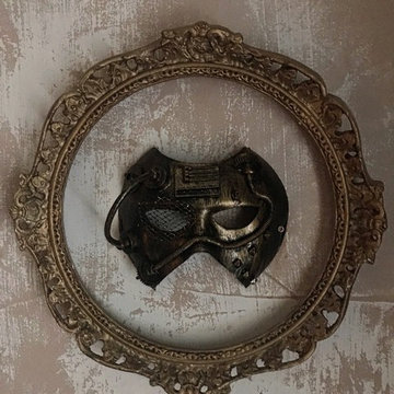 Rococo ornate round gold picture frame with steampunk mask