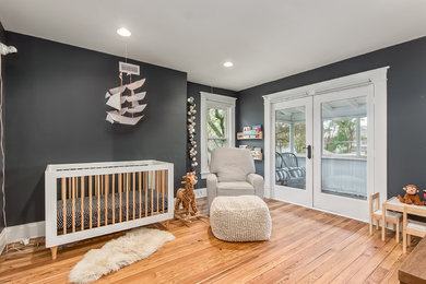 Example of a trendy nursery design in Columbus