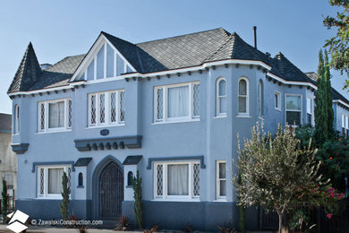 Inspiration for a timeless blue apartment exterior remodel in Los Angeles with a mixed material roof