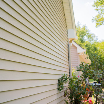 Seamless Polymer Siding in Mountain Clay w/ Energy Efficient Replacement Windows
