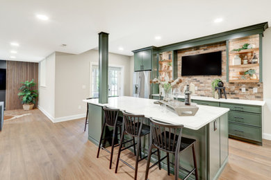 Basement - large walk-out vinyl floor, brown floor and wall paneling basement idea in Other with a bar and gray walls