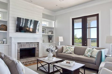 Family room - coastal family room idea in Charleston