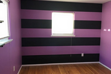Mid-sized guest bedroom photo in Detroit with purple walls