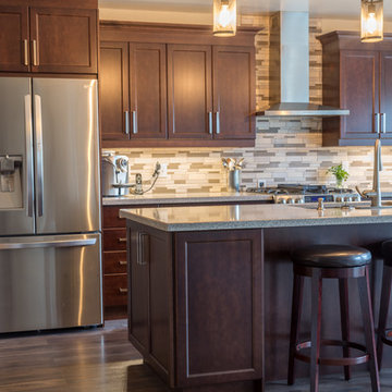 Falsetta - Brown Cabinets with Mosaic Tile Backsplash