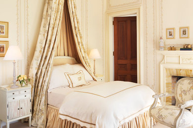 Bedroom - traditional carpeted bedroom idea in Providence with beige walls and a standard fireplace