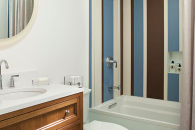 Trendy black tile and ceramic tile bathroom photo in Minneapolis with yellow walls