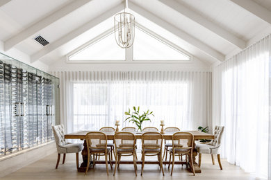 Design ideas for a beach style dining room in Melbourne with exposed beam.