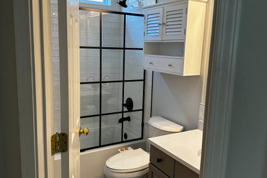 Example of a small classic white tile and subway tile single-sink bathroom design in Nashville with gray cabinets, a bidet, an undermount sink, quartzite countertops, white countertops, a niche and a freestanding vanity