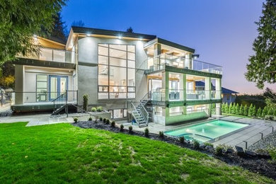 Inspiration for a large modern three-story exterior home remodel in Vancouver