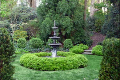 Inspiration for a huge traditional hillside brick landscaping in New York.