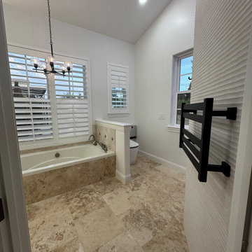 Curd-less walk-in shower; heated floors in bathroom + shower+bench LED