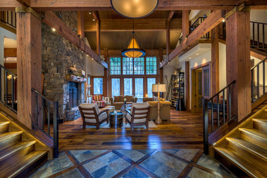 Inspiration for a rustic medium tone wood floor entryway remodel in Other with white walls