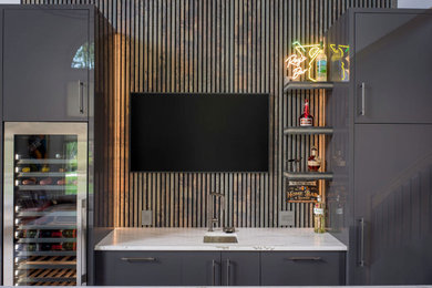 Example of a home bar design in Other