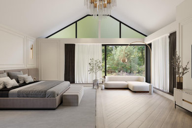 Inspiration for a large modern master and grey and brown bedroom in Kent with white walls and wainscoting.