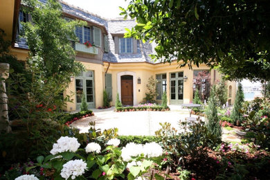 Example of a french country exterior home design in Orange County