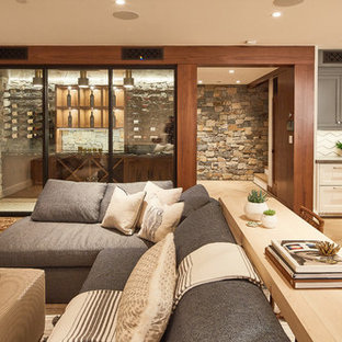 Traditional basement in Los Angeles with beige walls, light hardwood flooring and beige floors.