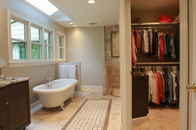 Inspiration for a huge transitional master beige tile and stone tile travertine floor bathroom remodel in San Diego with raised-panel cabinets, dark wood cabinets, a two-piece toilet, beige walls, an undermount sink and granite countertops