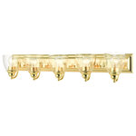 Livex Lighting - Polished Brass Transitional, Colonial, Vanity Sconce - Bring a beautiful new look to your bathroom or vanity area with this charming large five-light vanity sconce from the Birmingham collection. A wide rectangular polished brass finish back plate supports five simple graceful arms that hold five hand blown clear glass shades. The clean lines of this updated classic will make this piece an appealing part of your home.