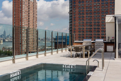 Inspiration for a mid-sized modern rooftop rectangular lap pool in New York with a pool house.