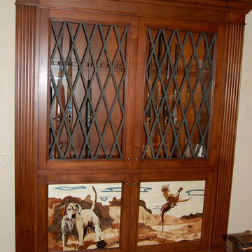 Custom Alder Gun Cabinet with Marquetry veneer panels.