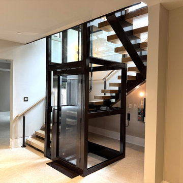 Project #136 | Modern Floating Staircase Encircling Glass Elevator