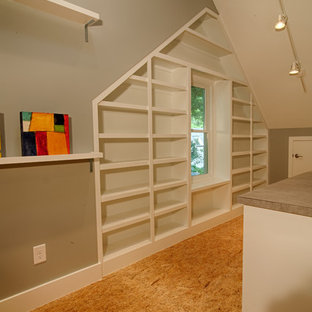 Design ideas for a large modern craft room in Raleigh with grey walls and a freestanding desk.