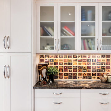 Unique Backsplash: textile art piece with shaker cabinetry above