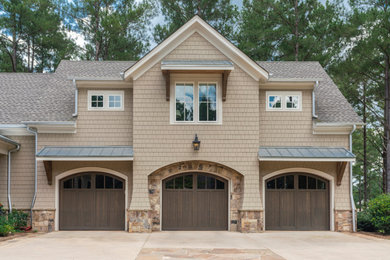 Arts and crafts three-car garage photo in Atlanta