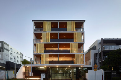 Design ideas for an expansive contemporary three-storey multi-coloured exterior in Brisbane with mixed siding.