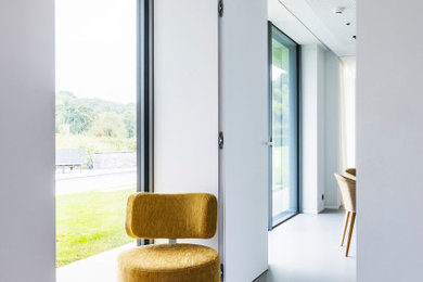 Large modern study in London with white walls.